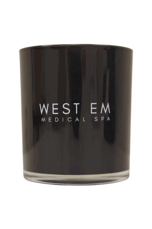 West Em Candle Volume 2 with black currant and citrus scented candle to create a relaxing atmosphere at West Em Medical Spa