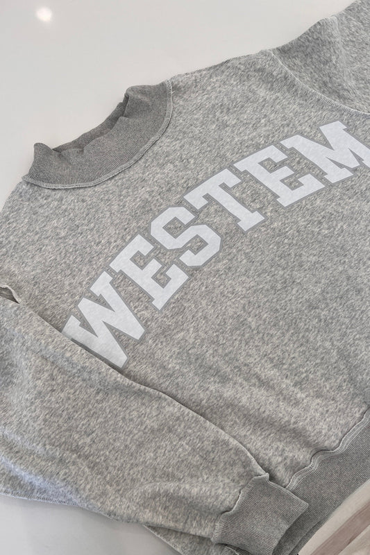 West Em gray crewneck sweatshirt inspired by the viral Parke crewneck, featuring a cozy relaxed fit available at West Em Medical Spa